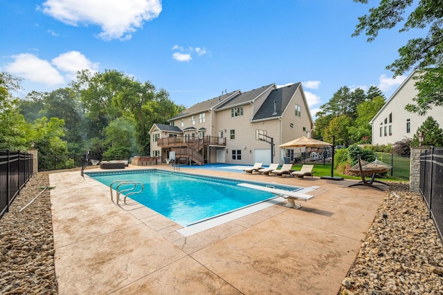 2012 Pine Ridge Dr W, Saint Paul, MN 55118 - view of swimming pool featuring a fenced in pool, a wooden deck, stairs, and a fenced backyard