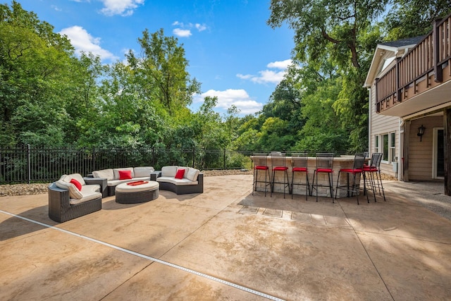 2012 Pine Ridge Dr W, Saint Paul, MN 55118 - view of patio / terrace with fence, an outdoor living space with a fire pit, and outdoor dry bar