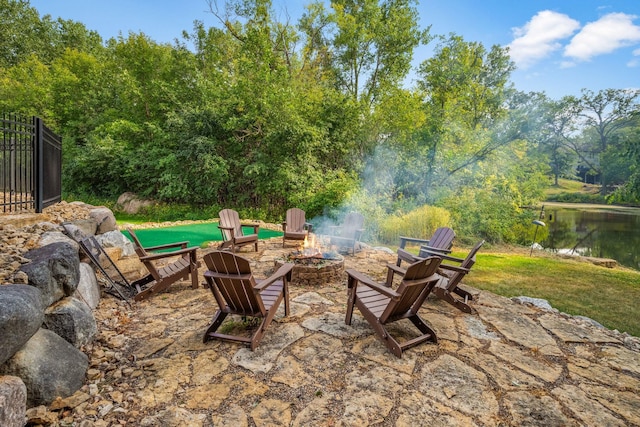 2012 Pine Ridge Dr W, Saint Paul, MN 55118 - view of patio with a water view and an outdoor fire pit