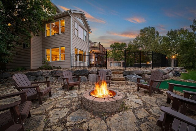 2012 Pine Ridge Dr W, Saint Paul, MN 55118 - patio terrace at dusk with an outdoor fire pit