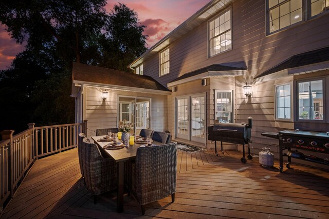 2012 Pine Ridge Dr W, Saint Paul, MN 55118 - deck at dusk featuring outdoor dining space
