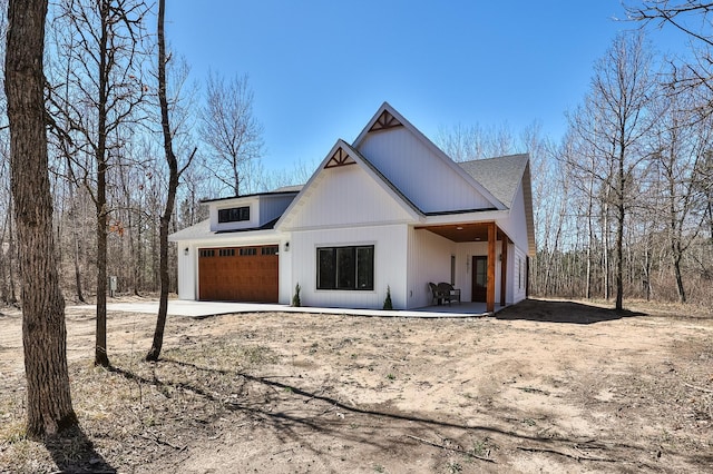 15821 Conifer Cir, Park Rapids, MN 56470 - view of front of property featuring a garage and concrete driveway
