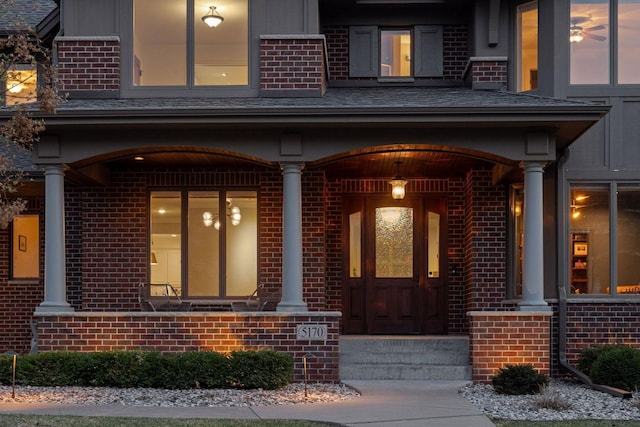 entrance to property with brick siding