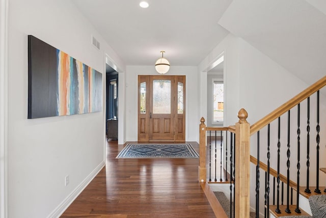 entrance foyer featuring wood finished floors, stairs, visible vents, baseboards, and recessed lighting