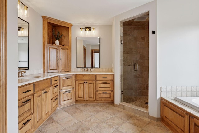 bathroom featuring double vanity, a bath, a shower stall, and a sink