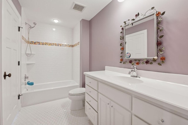 bathroom featuring toilet, vanity, visible vents, tile patterned floors, and bathtub / shower combination