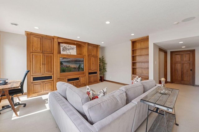 living area featuring baseboards, recessed lighting, light colored carpet, and built in shelves