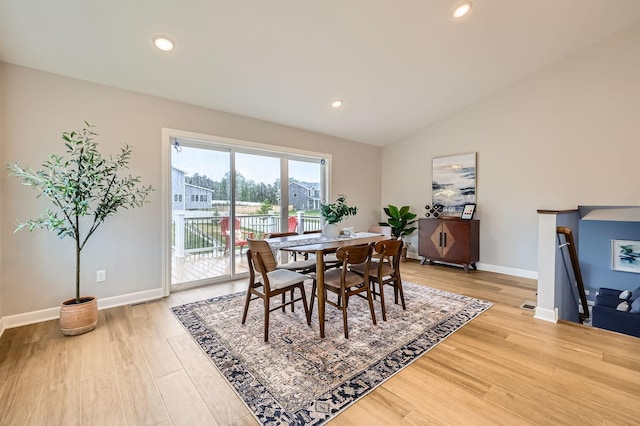 15141 Partridge St NW, Andover, MN 55304 - dining area featuring vaulted ceiling, light wood finished floors, baseboards, and recessed lighting