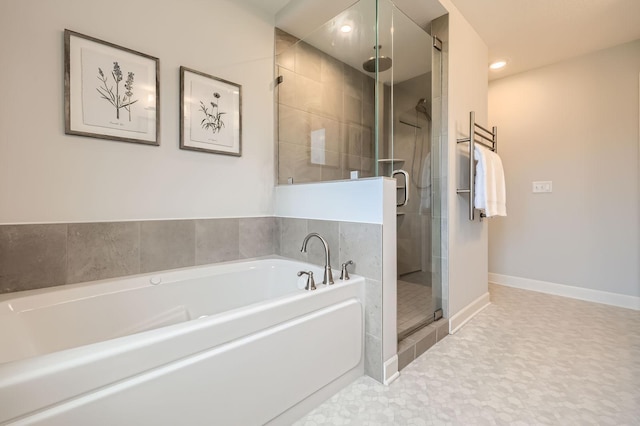 15141 Partridge St NW, Andover, MN 55304 - full bath featuring a stall shower, a bath, baseboards, and recessed lighting
