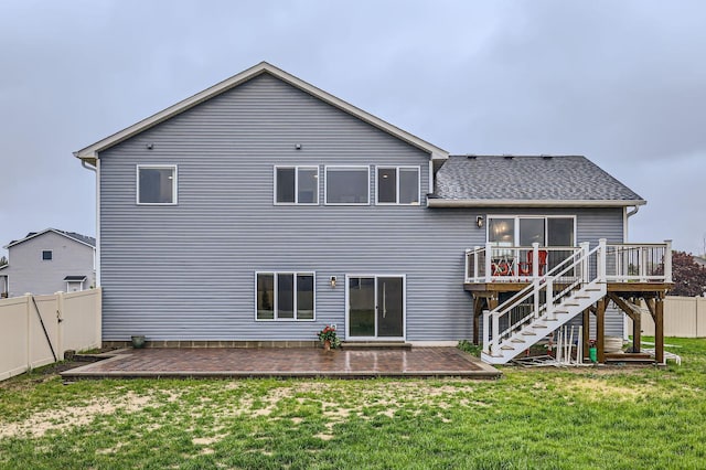 15141 Partridge St NW, Andover, MN 55304 - back of property featuring a wooden deck, stairway, and roof with shingles