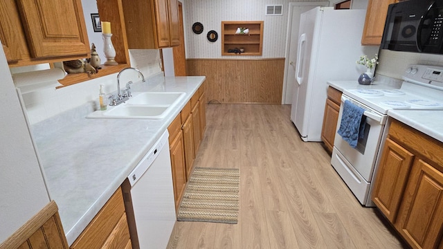 1509 2nd Ave SW, Austin, MN 55912 - kitchen featuring brown cabinets, visible vents, a sink, and white appliances