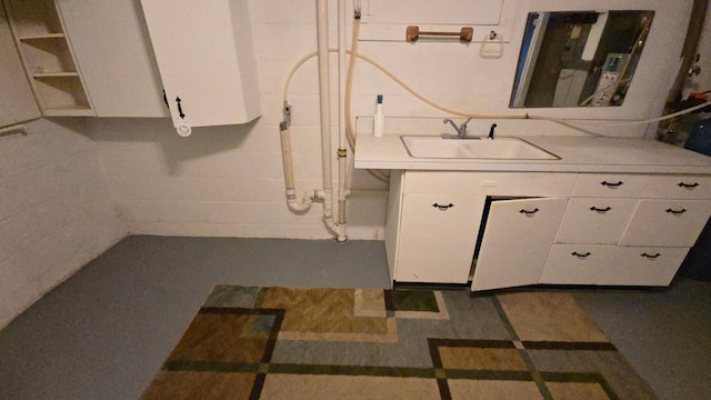 1509 2nd Ave SW, Austin, MN 55912 - bathroom featuring vanity and concrete block wall