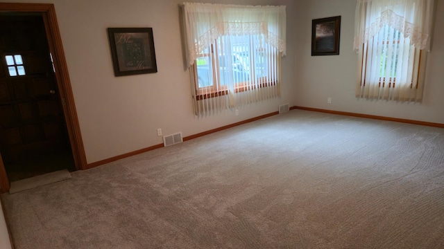 1509 2nd Ave SW, Austin, MN 55912 - carpeted spare room with plenty of natural light