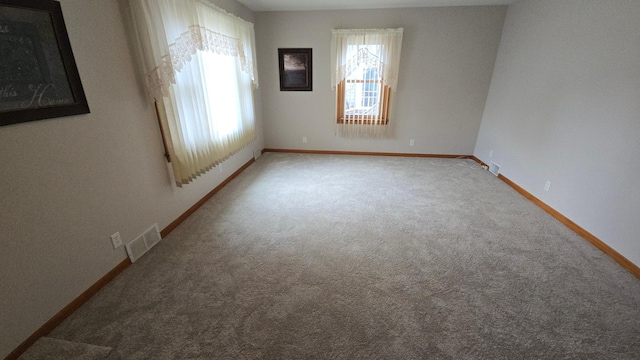 1509 2nd Ave SW, Austin, MN 55912 - carpeted spare room featuring baseboards