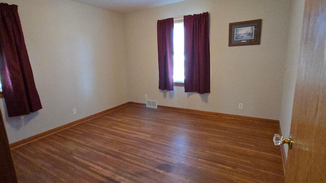 1509 2nd Ave SW, Austin, MN 55912 - spare room featuring wood finished floors and baseboards