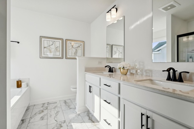 bathroom with double vanity, marble finish floor, a sink, and visible vents
