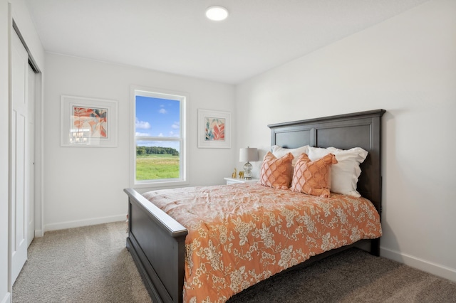 bedroom featuring carpet flooring and baseboards
