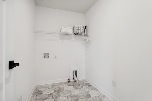 laundry area with baseboards, hookup for a gas dryer, laundry area, and washer hookup