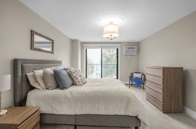 bedroom featuring light colored carpet, an AC wall unit, baseboards, and a baseboard radiator