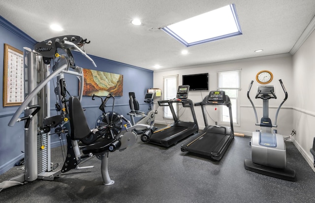 workout area with ornamental molding, a textured ceiling, baseboards, and recessed lighting
