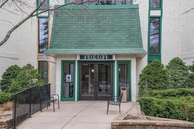 entrance to property with french doors and a patio
