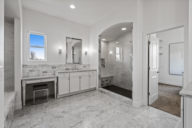bathroom with vanity, marble finish floor, baseboards, recessed lighting, and a shower stall
