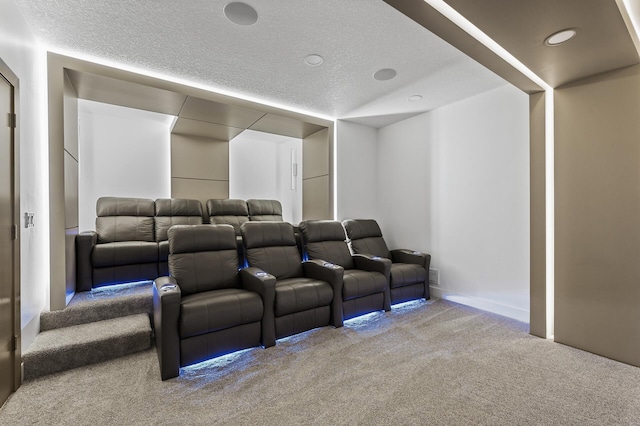 carpeted cinema featuring recessed lighting and a textured ceiling
