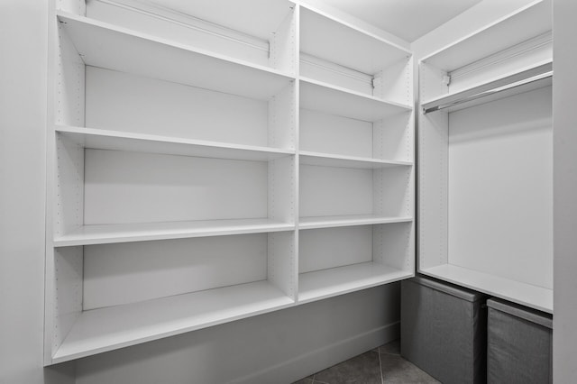 walk in closet featuring tile patterned flooring