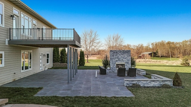 view of patio / terrace with an outdoor stone fireplace