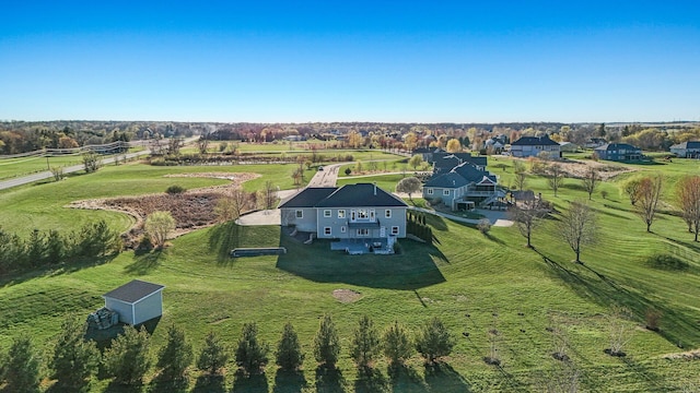 birds eye view of property with a rural view