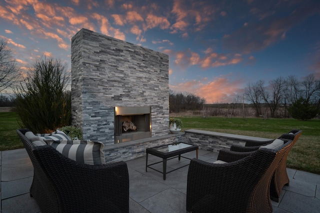 view of patio / terrace featuring an outdoor living space with a fireplace