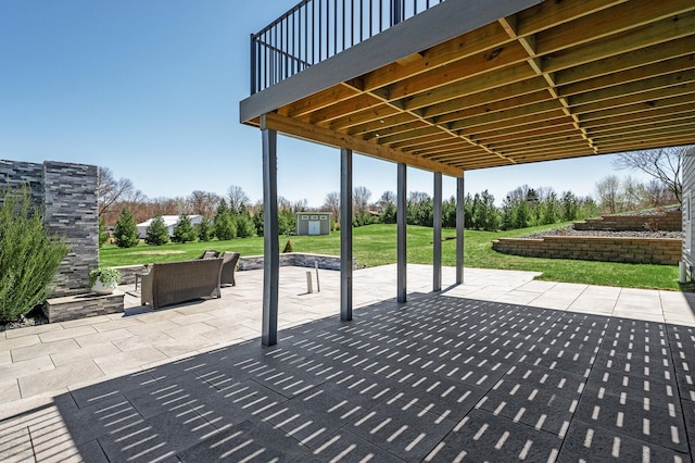 view of patio / terrace with an outbuilding and a shed