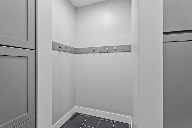 10906 Whitetail Rd, Rogers, MN 55374 - mudroom featuring dark tile patterned flooring and baseboards