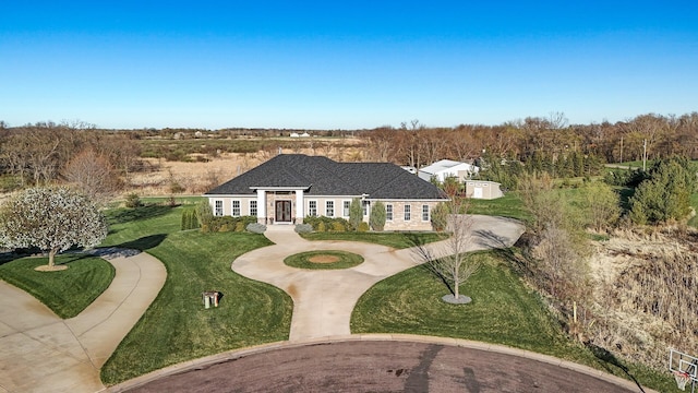 10906 Whitetail Rd, Rogers, MN 55374 - view of front facade with curved driveway, a front yard, and a shingled roof