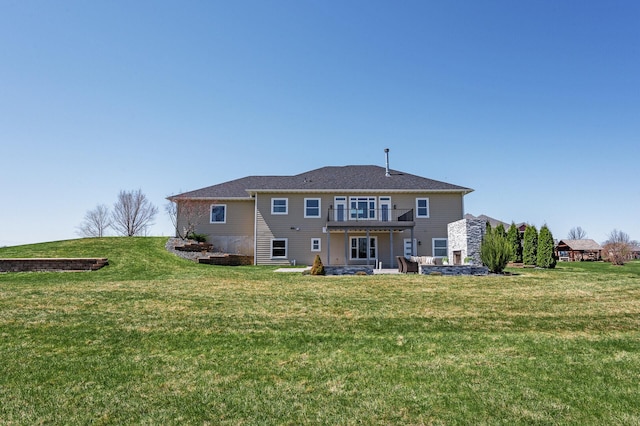 10906 Whitetail Rd, Rogers, MN 55374 - back of property with a lawn and a balcony
