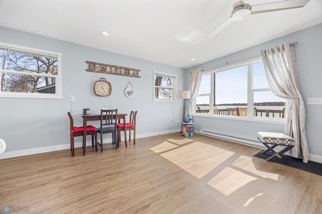 interior space with baseboards, ceiling fan, recessed lighting, and wood finished floors