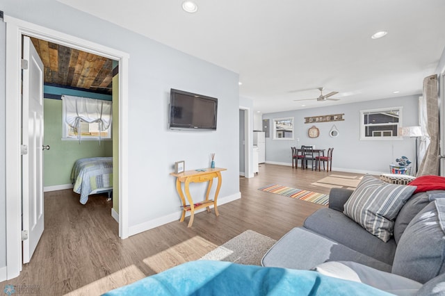 living area with recessed lighting, baseboards, ceiling fan, and wood finished floors
