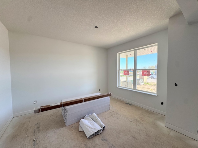 9706 Jasmine Ave NE, Hanover, MN 55341 - empty room featuring baseboards and a textured ceiling