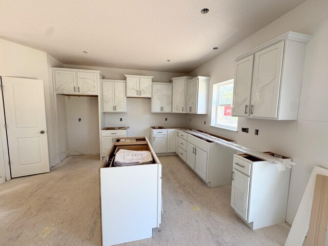 9706 Jasmine Ave NE, Hanover, MN 55341 - kitchen with a kitchen island and white cabinets