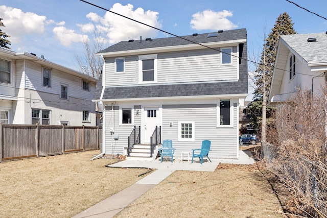 1744 Jefferson Ave, Saint Paul, MN 55105 - rear view of property featuring entry steps, roof with shingles, and a patio area