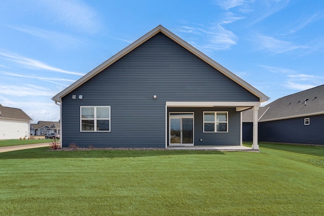 19336 Grass Lake Trl, Rogers, MN 55374 - rear view of property with a patio area and a lawn