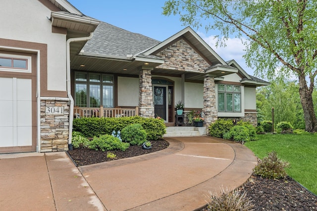 3041 209th Ln NW, Oak Grove, MN 55011 - view of exterior entry featuring stone siding, stucco siding, a porch, and a lawn