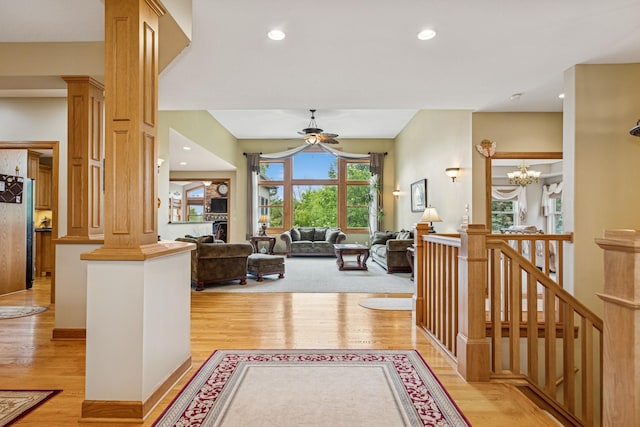 3041 209th Ln NW, Oak Grove, MN 55011 - hallway with light wood-style floors, a chandelier, recessed lighting, and ornate columns