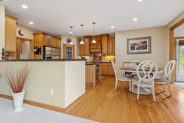 3041 209th Ln NW, Oak Grove, MN 55011 - kitchen featuring built in fridge, dark stone counters, backsplash, light wood finished floors, and recessed lighting