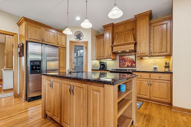3041 209th Ln NW, Oak Grove, MN 55011 - kitchen featuring stainless steel appliances, open shelves, tasteful backsplash, a center island with sink, and light wood-style floors
