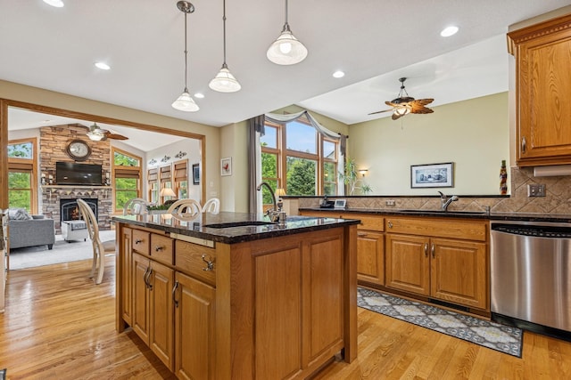 3041 209th Ln NW, Oak Grove, MN 55011 - kitchen featuring stainless steel dishwasher, a ceiling fan, a sink, open floor plan, and lofted ceiling