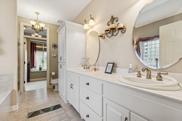 3041 209th Ln NW, Oak Grove, MN 55011 - bathroom featuring a chandelier, toilet, healthy amount of natural light, and double vanity