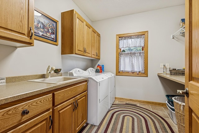 3041 209th Ln NW, Oak Grove, MN 55011 - laundry room with cabinet space, washer and clothes dryer, baseboards, and light tile patterned flooring