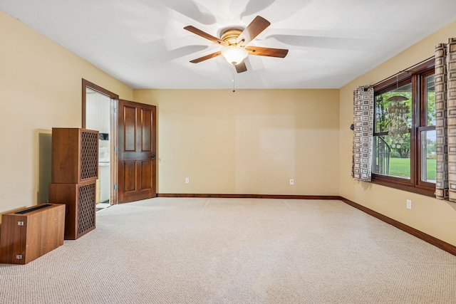 3041 209th Ln NW, Oak Grove, MN 55011 - spare room featuring carpet, a ceiling fan, and baseboards