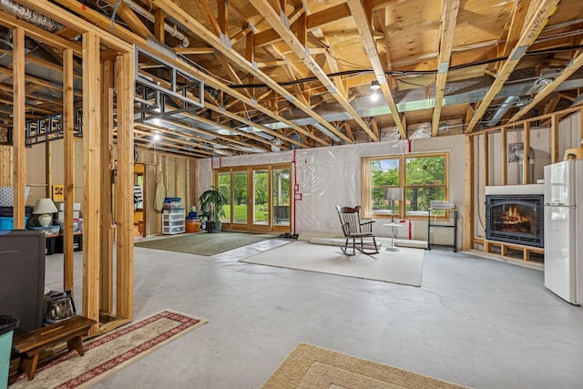 3041 209th Ln NW, Oak Grove, MN 55011 - below grade area featuring freestanding refrigerator and a lit fireplace